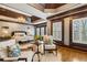 Bright, spacious bedroom with a sitting area, chandelier, and wide shuttered windows at 2353 Habersham Sw Dr, Marietta, GA 30064