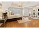 Spacious main bedroom with tray ceilings, plantation shutters, and a cozy sitting area with a fireplace at 2353 Habersham Sw Dr, Marietta, GA 30064