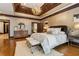 Elegant main bedroom featuring a tray ceiling, detailed trim work, and hardwood floors at 2353 Habersham Sw Dr, Marietta, GA 30064