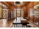 Elegant office with wood paneling, a modern desk, and a bay window with shuttered blinds at 2353 Habersham Sw Dr, Marietta, GA 30064