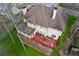 Rear exterior of the home featuring a multi-level red deck and a well-maintained lawn at 2353 Habersham Sw Dr, Marietta, GA 30064