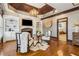Sitting area in main bedroom featuring custom built-ins, a fireplace, and hardwood floors at 2353 Habersham Sw Dr, Marietta, GA 30064