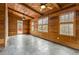 Charming sun room featuring wood-paneled walls and ceiling, with tile flooring and plenty of natural light at 2353 Habersham Sw Dr, Marietta, GA 30064