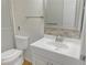 Clean and modern bathroom featuring a white vanity, updated fixtures, and a tiled backsplash at 475 Mount Vernon Ne Hwy # C230, Sandy Springs, GA 30328