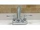 Close-up of a bathroom faucet with decorative tile backsplash at 475 Mount Vernon Ne Hwy # C230, Sandy Springs, GA 30328