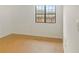 Bright bedroom featuring wood-look flooring and a window for natural light at 475 Mount Vernon Ne Hwy # C230, Sandy Springs, GA 30328