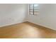 Bright bedroom featuring wood-look flooring and a window for natural light at 475 Mount Vernon Ne Hwy # C230, Sandy Springs, GA 30328