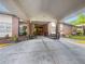 Welcoming entrance with covered drive, benches, and planters at an attractive brick apartment building at 475 Mount Vernon Ne Hwy # C230, Sandy Springs, GA 30328