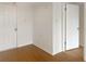 Entryway featuring wood-look floors, a white front door and a secondary open door at 475 Mount Vernon Ne Hwy # C230, Sandy Springs, GA 30328