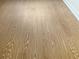 Close-up on modern wood-look laminate flooring with unique grain pattern at 475 Mount Vernon Ne Hwy # C230, Sandy Springs, GA 30328