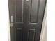 Close-up of a front door with a combination lock and handle at 475 Mount Vernon Ne Hwy # C230, Sandy Springs, GA 30328
