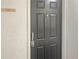 Apartment C-230 entry door featuring modern lever handle and deadbolt for added security at 475 Mount Vernon Ne Hwy # C230, Sandy Springs, GA 30328
