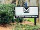 Street view of the Mount Vernon Village community sign with address set amongst lush greenery at 475 Mount Vernon Ne Hwy # C230, Sandy Springs, GA 30328