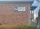 Exterior brick building with signage displaying Mount Vernon Village for independent senior living at 475 Mount Vernon Ne Hwy # C230, Sandy Springs, GA 30328