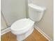 Close-up view of a toilet with wood-look flooring at 475 Mount Vernon Ne Hwy # C230, Sandy Springs, GA 30328