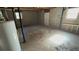 Unfinished basement offers potential for customization with exposed ceiling and concrete floors at 533 Fayetteville Rd, Fairburn, GA 30213