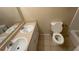 Bathroom featuring a dual sink vanity, a toilet, and a tile floor at 533 Fayetteville Rd, Fairburn, GA 30213