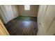 Bedroom with new laminate floors, closet, and natural light at 533 Fayetteville Rd, Fairburn, GA 30213