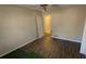 Bedroom with laminate floors, closet, and ceiling fan at 533 Fayetteville Rd, Fairburn, GA 30213
