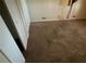 View of a bedroom featuring neutral-colored walls, standard carpet, and visible wall damage at 533 Fayetteville Rd, Fairburn, GA 30213