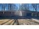 Charming single-story brick home with a covered carport and mature trees in a peaceful neighborhood at 533 Fayetteville Rd, Fairburn, GA 30213