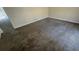 Spacious living room with neutral walls and wall-to-wall carpeting offering a comfortable living space at 533 Fayetteville Rd, Fairburn, GA 30213