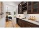 Stylish bar area featuring custom cabinets, wine storage, and elegant countertop at 4895 Lansbury Dr, Atlanta, GA 30342