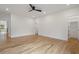 Bright and airy bedroom with hardwood floors, walk-in closet and ensuite bathroom entrance at 4895 Lansbury Dr, Atlanta, GA 30342