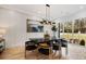 Bright dining area boasting modern decor, stylish chairs, and hardwood floors at 4895 Lansbury Dr, Atlanta, GA 30342