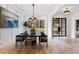 Elegant dining room with a black marble table, stylish chairs, and hardwood flooring at 4895 Lansbury Dr, Atlanta, GA 30342