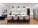 Modern kitchen with a large island, pendant lighting, and stainless steel appliances at 4895 Lansbury Dr, Atlanta, GA 30342