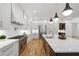 Bright eat-in kitchen with modern appliances, white cabinets and marble backsplash at 4895 Lansbury Dr, Atlanta, GA 30342