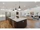 Bright eat-in kitchen features modern appliances, a large island with seating, and an open floorplan at 4895 Lansbury Dr, Atlanta, GA 30342