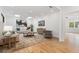 Relaxing living room with modern decor, skylights, stylish furniture, and hardwood floors at 4895 Lansbury Dr, Atlanta, GA 30342