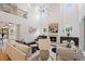 Open-concept living room with a fireplace, stylish decor, and hardwood floors at 4895 Lansbury Dr, Atlanta, GA 30342