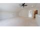 Large bonus room with white walls and ceiling includes access to bathroom at 158 South Village Ave, Holly Springs, GA 30115