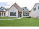Charming single-Gathering home with stone facade, well-manicured lawn, and inviting entrance at 158 South Village Ave, Holly Springs, GA 30115