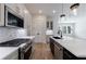 Modern kitchen featuring a large island, stainless steel appliances, and stylish finishes at 158 South Village Ave, Holly Springs, GA 30115