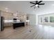Open concept living area featuring an eat-in kitchen with modern cabinetry at 158 South Village Ave, Holly Springs, GA 30115
