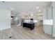Open concept living area featuring an eat-in kitchen with modern cabinetry at 158 South Village Ave, Holly Springs, GA 30115