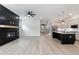 Spacious living room with a fireplace and an eat-in kitchen with modern cabinetry at 158 South Village Ave, Holly Springs, GA 30115