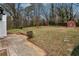 Large backyard showcasing a patio with shed and lush greenery at 5063 White Sw Blvd, Mableton, GA 30126