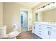 Bathroom features a double vanity with marble countertops, and modern lighting fixtures, offering a clean, bright space at 5063 White Sw Blvd, Mableton, GA 30126