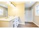 Bright bathroom features a double sink vanity with stone countertop and modern fixtures at 5063 White Sw Blvd, Mableton, GA 30126