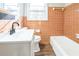 Cozy bathroom features vintage style tile and fixtures at 5063 White Sw Blvd, Mableton, GA 30126