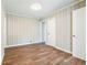 Inviting bedroom featuring wood-look floors, neutral paint, and closet space for comfortable living at 5063 White Sw Blvd, Mableton, GA 30126