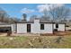 Rear exterior showing a white siding and an oversized yard at 5063 White Sw Blvd, Mableton, GA 30126