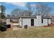 Rear exterior view featuring a convenient carport at 5063 White Sw Blvd, Mableton, GA 30126