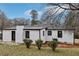 Well-maintained exterior with lush landscaping on a sunny day at 5063 White Sw Blvd, Mableton, GA 30126