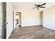 Inviting living room featuring wood floors, a ceiling fan, and an open layout at 5063 White Sw Blvd, Mableton, GA 30126
